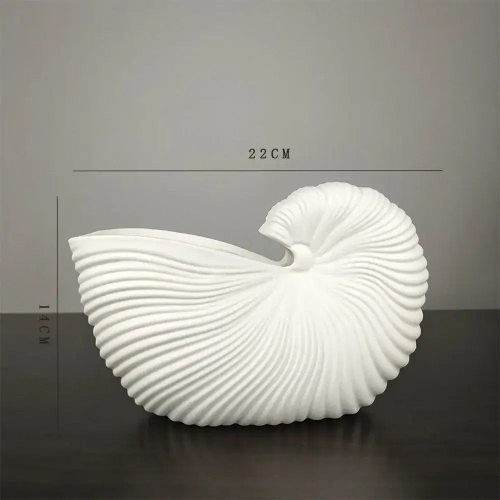 Decorbites™ elegant ceramic vase featuring a sleek white shell conch design with smooth ridged spirals and glossy finish