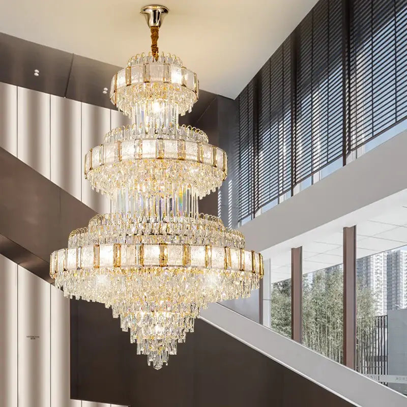 A decorbites elegant crystal multi-tiered chandelier with gold accents and cascading clear glass prisms for dining room
