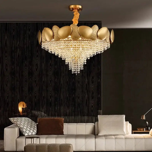 Gold-toned decorbites elegant crystal chandelier with tiered metallic petals and cascading crystal droplets for living room