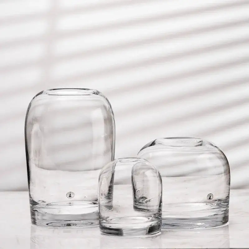 Clear glass flower vases with rounded bulbous shapes and thick bases by DecorBites elegant European INS