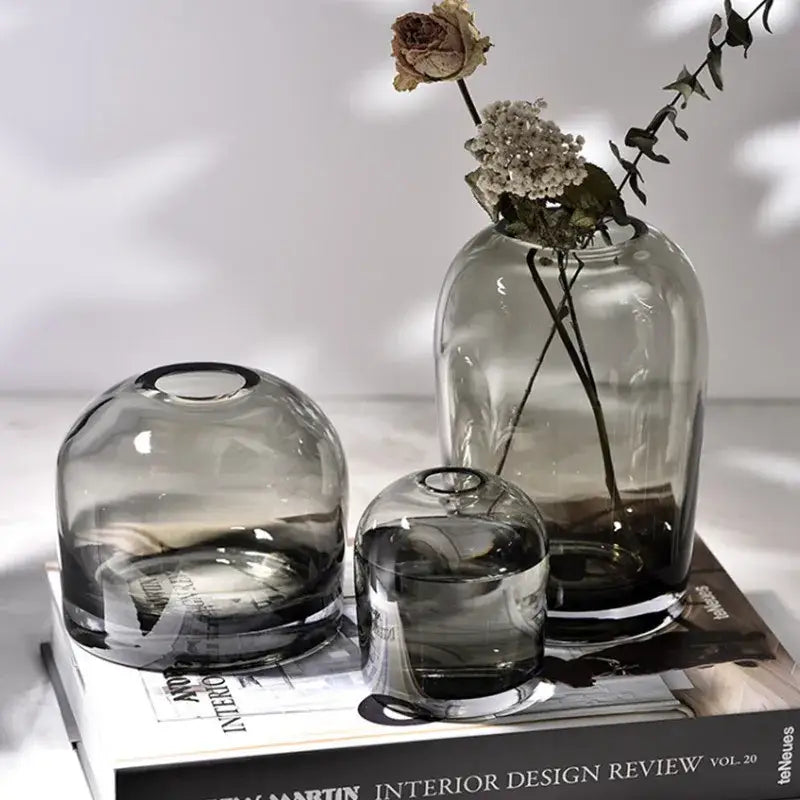 A set of three translucent gray glass flower vases with rounded shapes and subtle gradient from decorbites™ elegant european ins