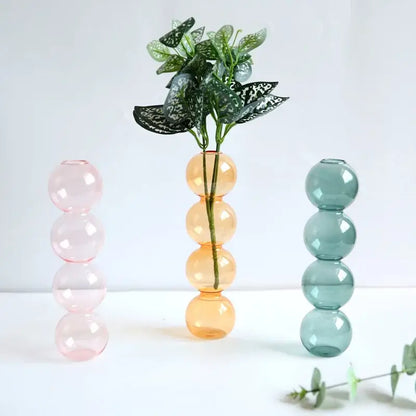 Pastel-colored glass vase with stacked spherical segments elegant glass vase for home decor by decorbites