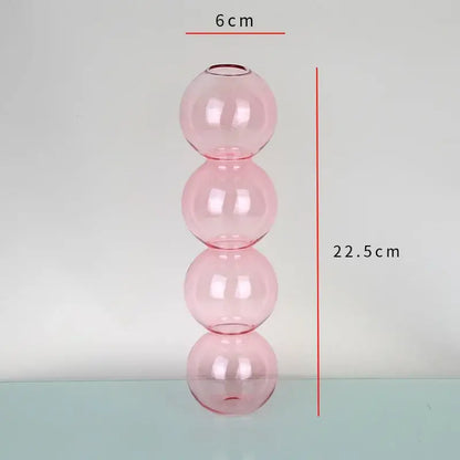 DecorBites™ elegant glass vase in translucent pink composed of four stacked spheres for stylish home decor