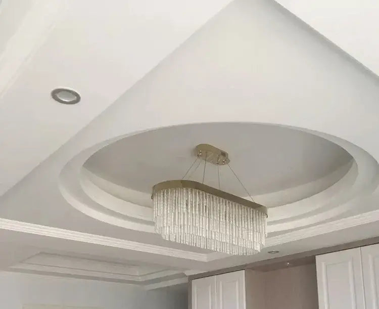 Decorbites™ elegant gold crystal chandelier with cascading clear crystal strands and modern gold luster frame for home lighting