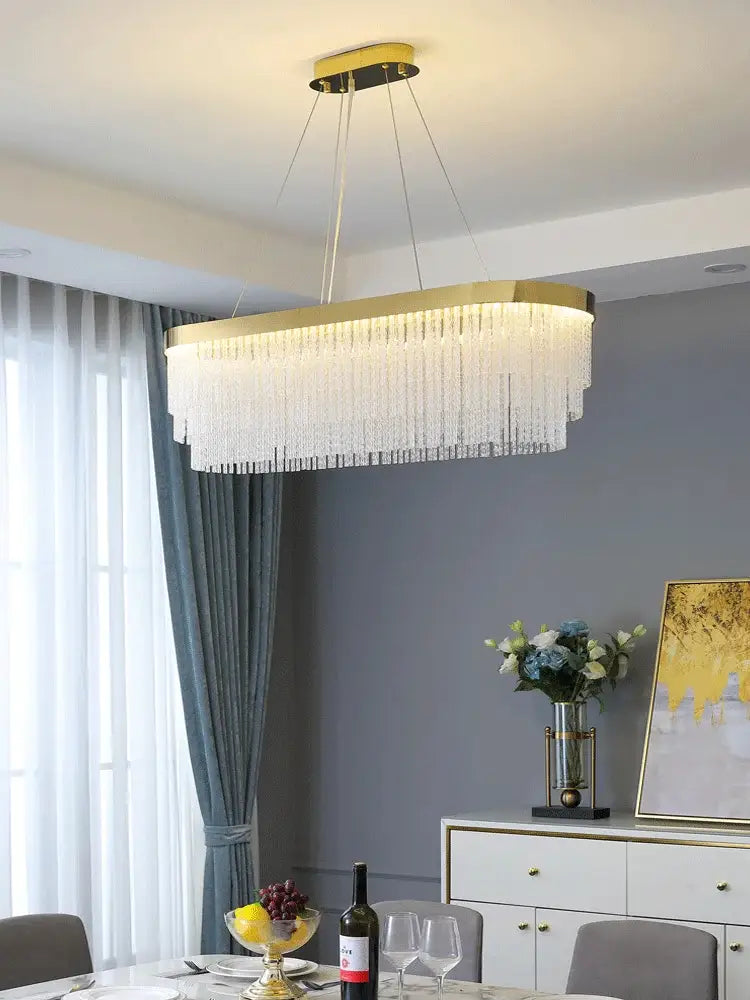 Decorbites elegant gold crystal chandelier with modern gold luster and cascading clear crystal strands for home lighting