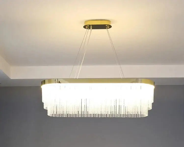 DecorBites elegant gold crystal chandelier features a modern gold luster frame with cascading clear crystal prisms