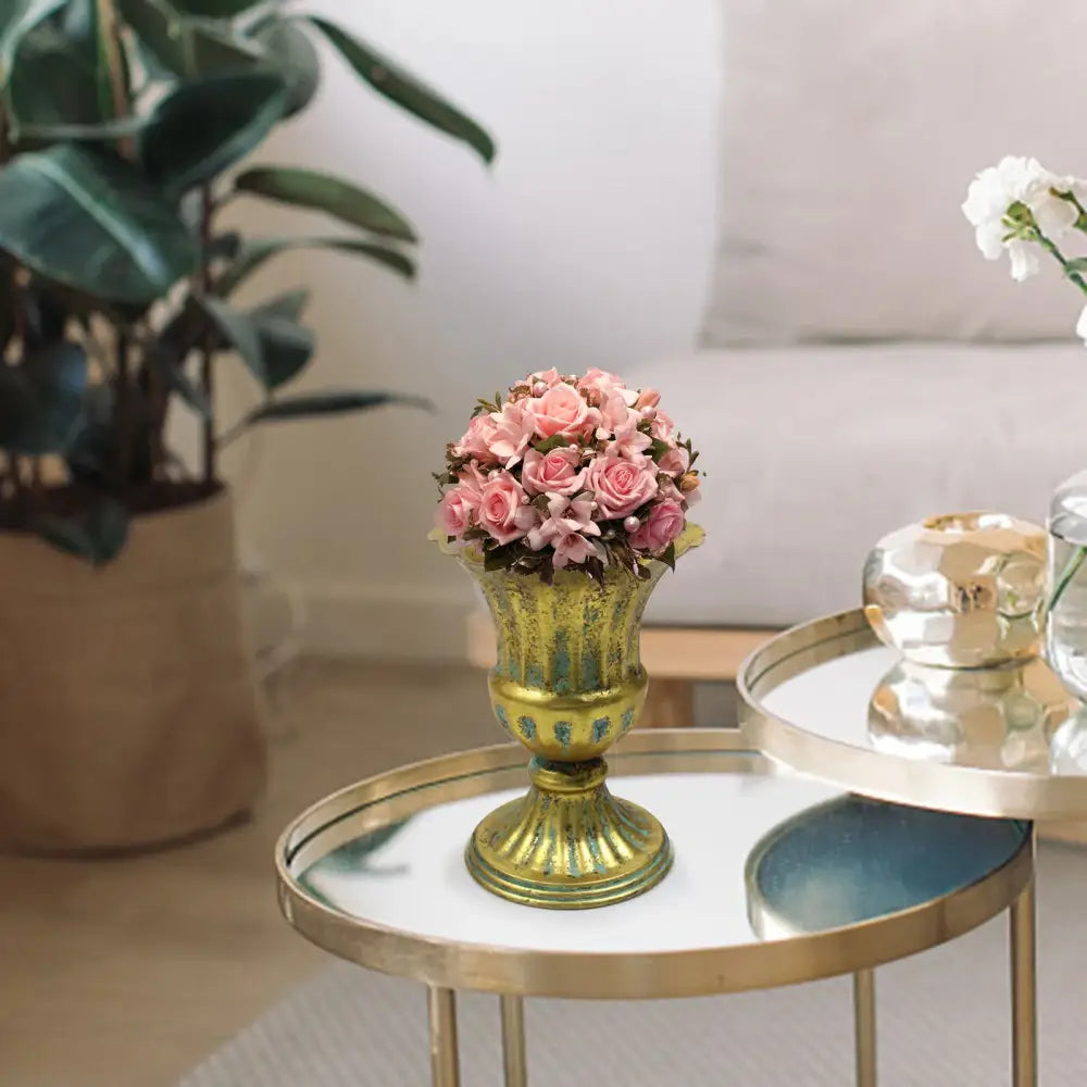 DecorBites™ elegant gold-toned metal flower vase with fluted detailing holding pink roses in a vintage style