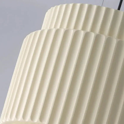Cream-colored ribbed pendant lamp with smooth matte finish from decorbites elegant resin collection for dining rooms