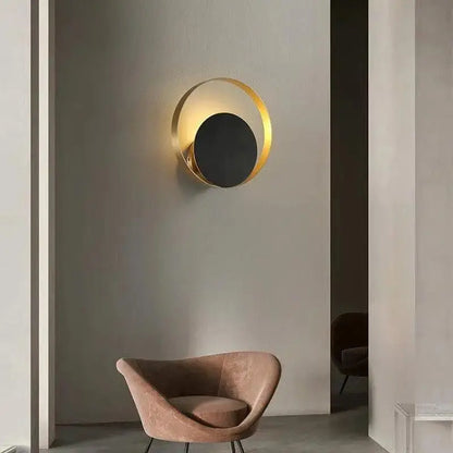 Decorbites ellen modern wall sconce in gold tone with black inner disc for sophisticated modern wall lighting elegance