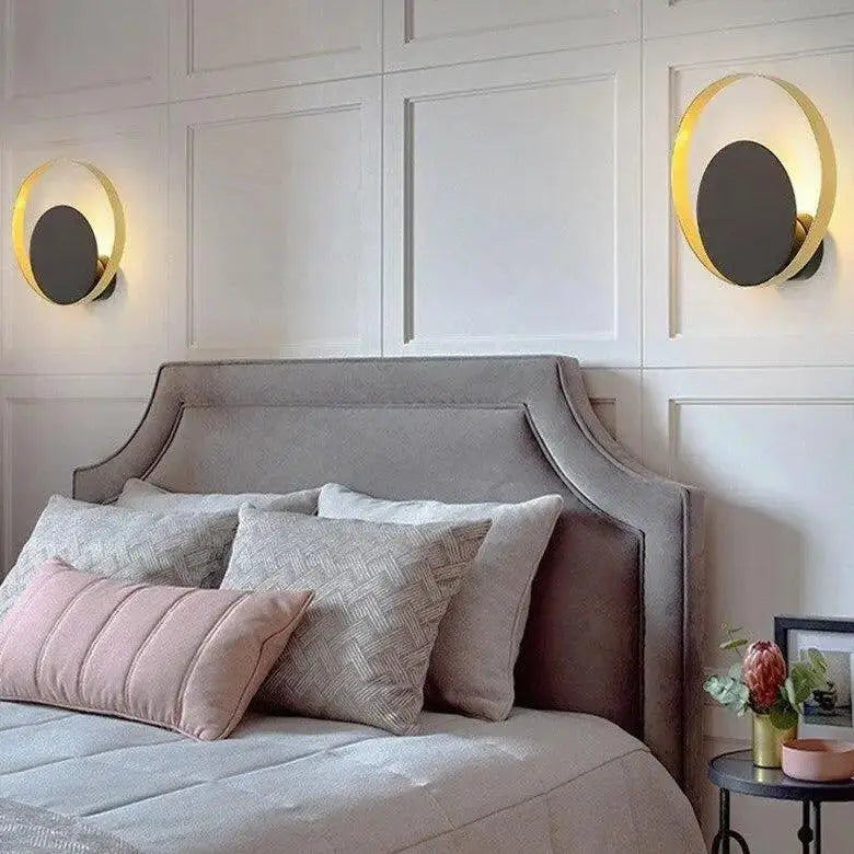 Decorbites™ ellen modern wall sconces feature gold-rimmed circular design with dark gray centers on white paneled walls