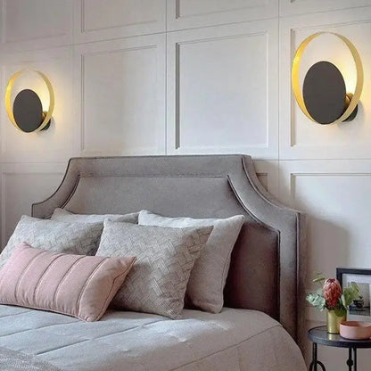 Decorbites™ ellen modern wall sconces feature gold-rimmed circular design with dark gray centers on white paneled walls