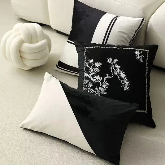 Black velvet cushion cover with white embroidered bamboo design and chain-stitched border by decorbites embroidered black white