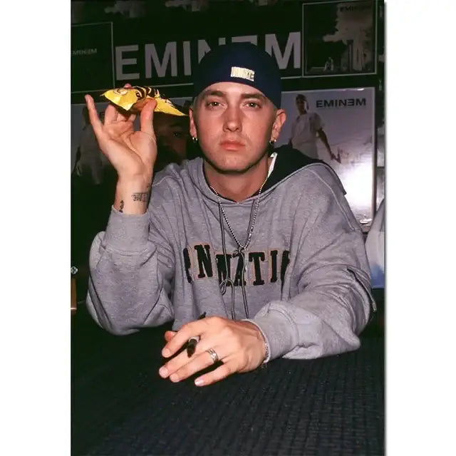 Decorbites™ eminem canvas wall art featuring eminem in a gray hoodie with black lettering for stylish home decor