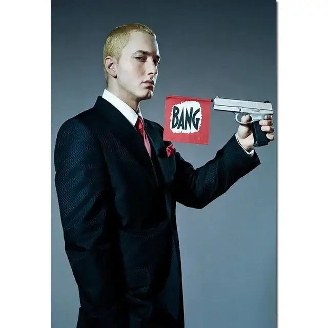 Silver handgun with black grip held by a man in dark suit featured in decorbites eminem canvas wall art for home decor