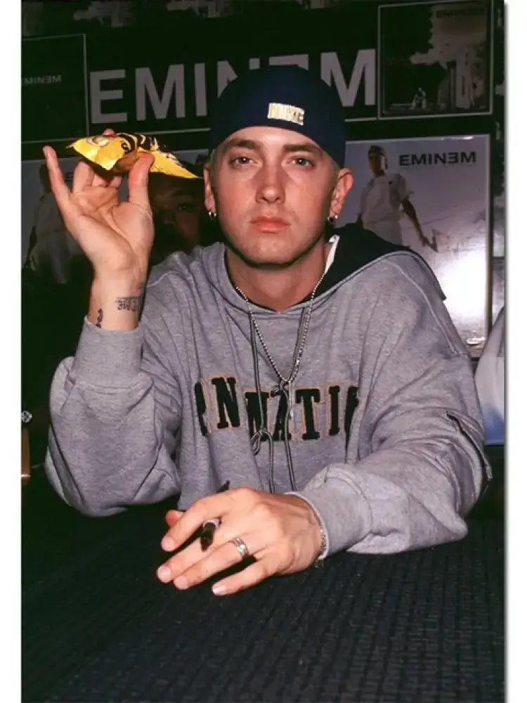 Decorbites emineme poster featuring eminem in a gray hoodie with innati print as music star wall art