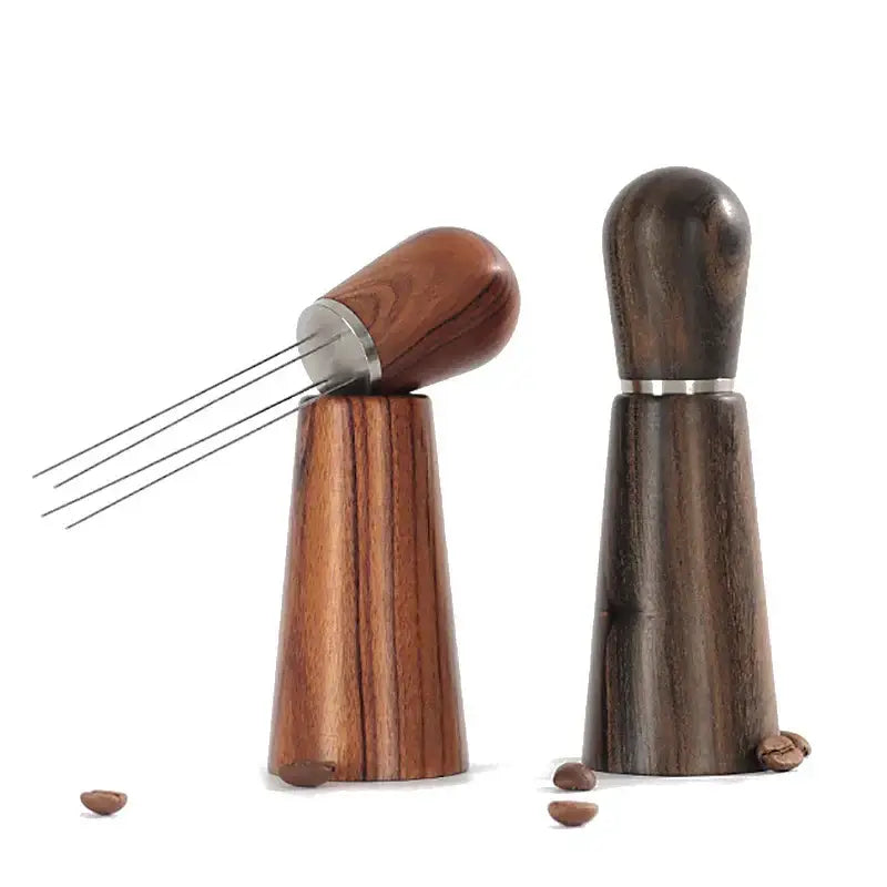 Two dark wood grain decorbites espresso stirrer tools with metal tines and cylindrical pressers for coffee distribution