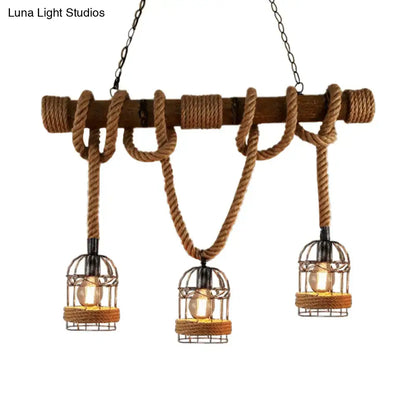 Rustic farmhouse chandelier featuring brown iron bird cage pendant lights with rope and wood pole accents