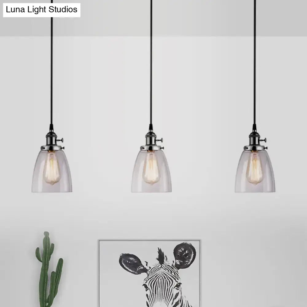 Decorbites farmhouse pendant light with three clear glass cone shades and exposed bulbs on a black linear canopy