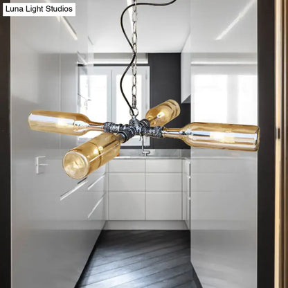 Industrial-style DecorBites farmhouse smoke gray blue glass hanging lamp with four amber wine bottles in aged silver black
