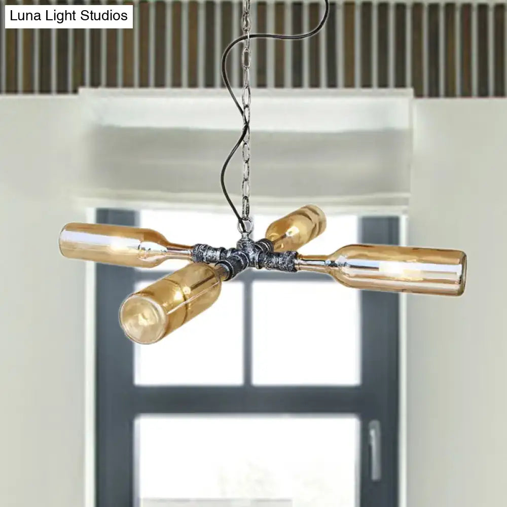 Industrial chandelier with four amber glass bottles in aged silver black metal and smoke gray blue finish hanging lamp