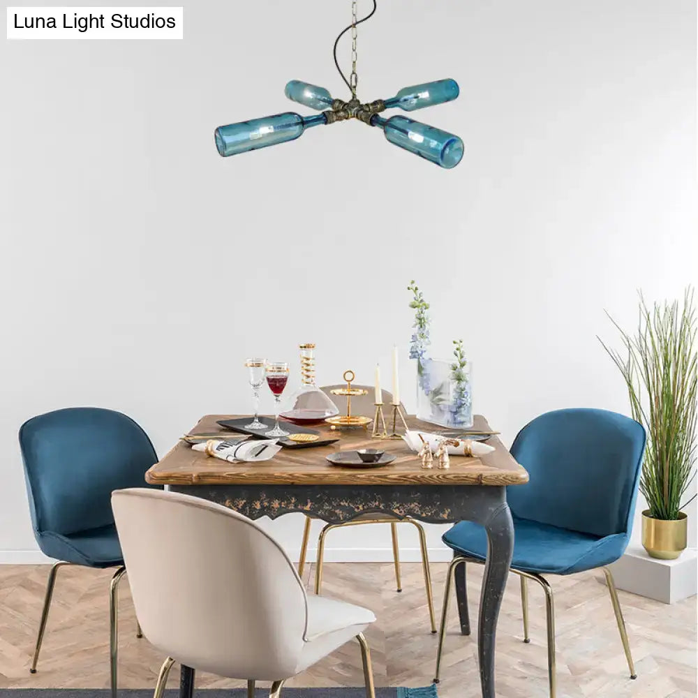 Blue glass bottle chandelier with brass fixture in aged silver black from DecorBites farmhouse smoke gray blue lighting