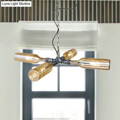 Industrial-style chandelier with four amber glass bottles in smoke gray blue and aged silver black metal fixture
