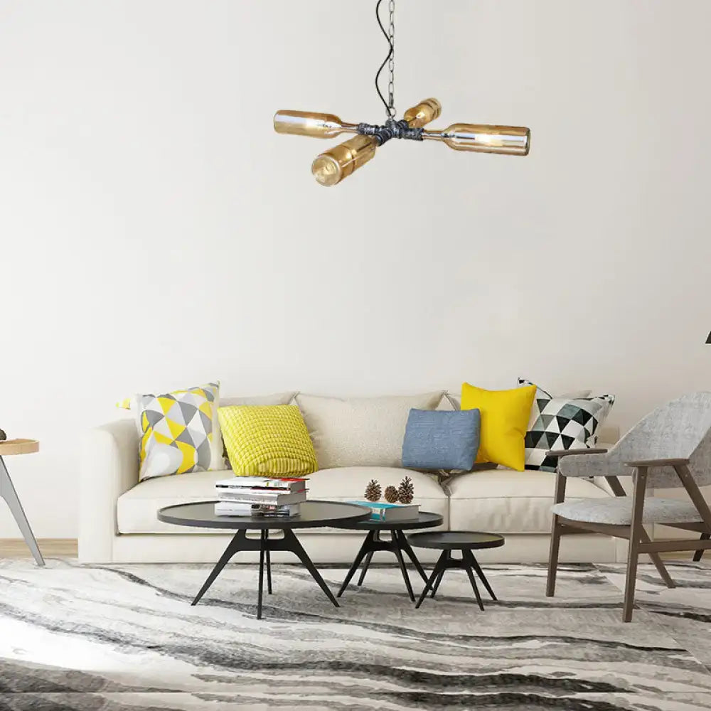 Industrial-style chandelier with four amber glass bottles in aged silver black finish and smoke gray blue tones suspended by black chain