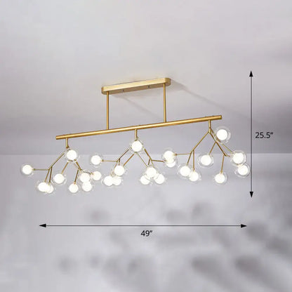 Gold-toned DecorBites™ Firefly Island pendant light with 27 clear glass globes black gold acrylic 110v-120v 220v-240v