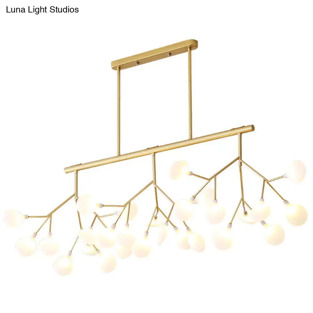 Gold-toned firefly island pendant with branching metal arms and frosted glass globe bulbs for modern restaurant lighting