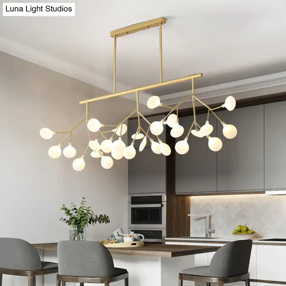 Modern gold-toned firefly island pendant with 36 frosted glass globe bulbs in postmodern metal design for restaurants