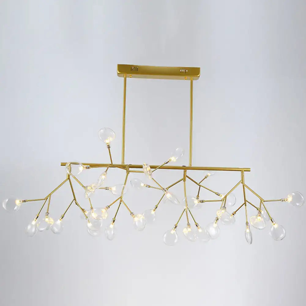 Gold-toned firefly led island pendant light with clear glass globe bulbs and branching metal frame for dining room ceiling
