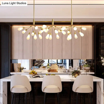 Gold-toned DecorBites™ Firefly suspension light with brass finish and 27 frosted glass globes in a tree-like design