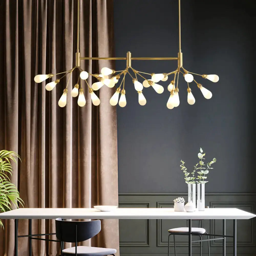 Gold-toned brass finish firefly suspension light with 27 frosted glass bulbs in a modern branching design