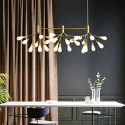 Gold-toned brass finish firefly suspension light with 27 frosted glass bulbs in a modern branching design