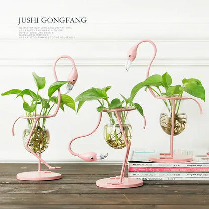 Decorbites™ flamingo metal vase home decor featuring pink metal flamingo planters with glass water bowls and green plants