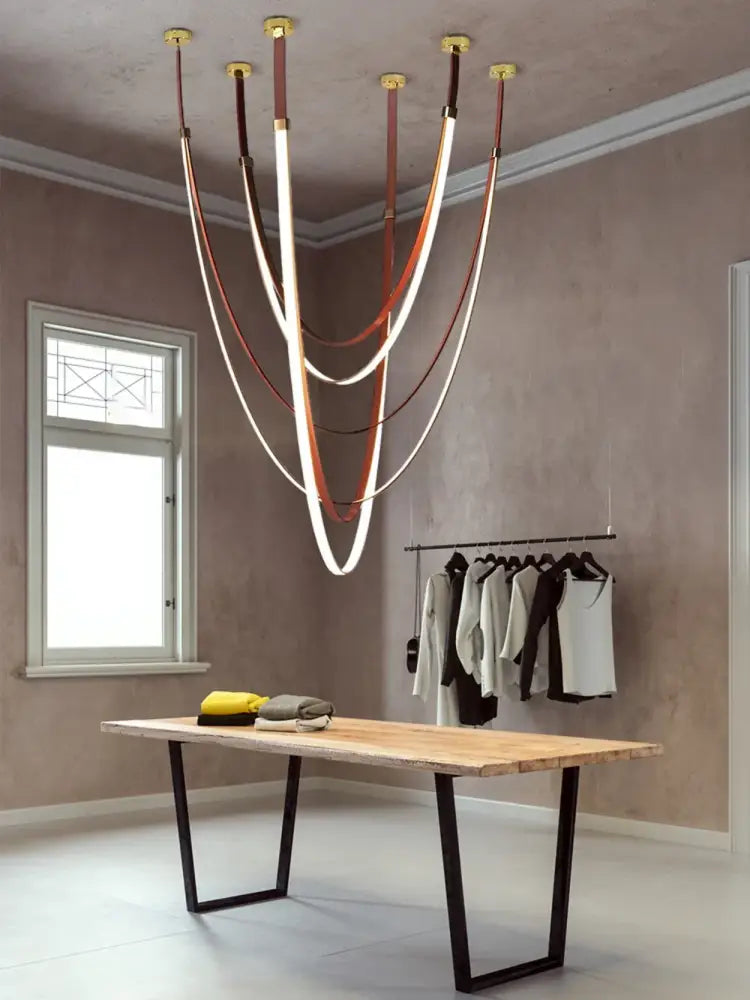 DecorBites™ flexible leather belt led chandelier with multiple curved illuminated strips in brown and white tones