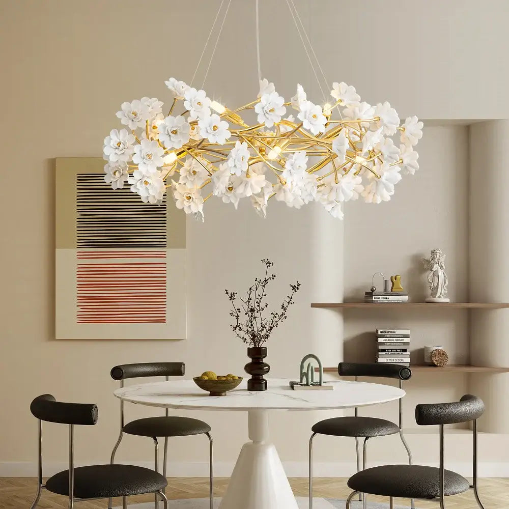 Decorbites™ floral french white ceramic chandelier with gold-toned stems and delicate white flower chandelier petals above dining table