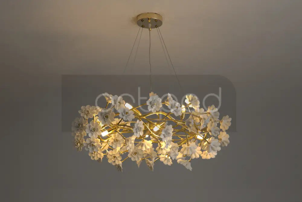 DecorBites™ floral French white ceramic chandelier with gold-toned branches and illuminated white flower chandelier design