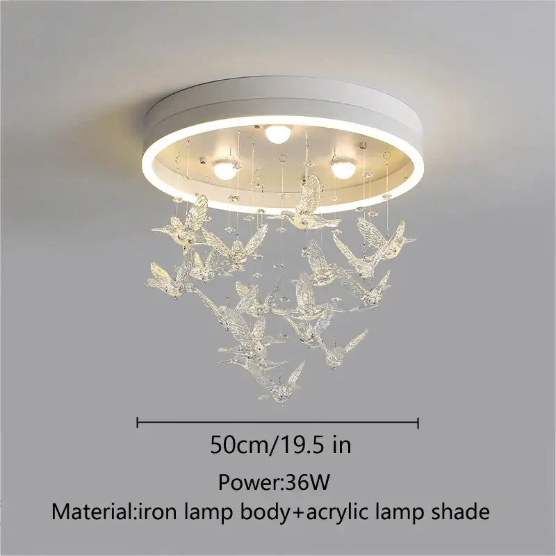 White circular ceiling light with clear acrylic bird figurines hanging below from decorbites flying bird ceiling light