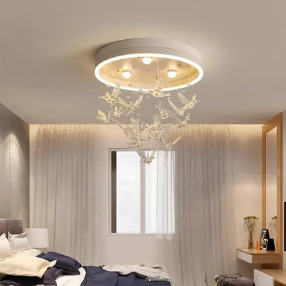 Decorbites flying bird white crystal ceiling light features a modern circular design with hanging crystal bird ornaments