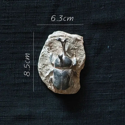 Decorbites fossil series art refrigerator sticker of a fossilized rhinoceros beetle in beige rock kitchen decor