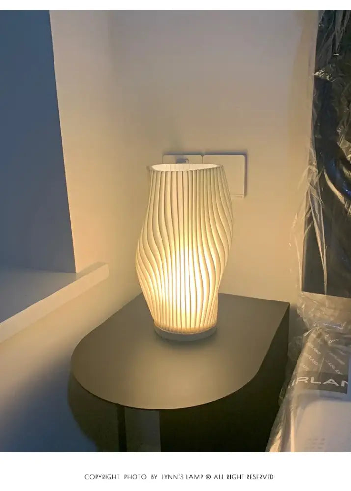 Modern cream-colored decorbites™ french cream style 3d desk lamp with ribbed design and warm ambient lighting