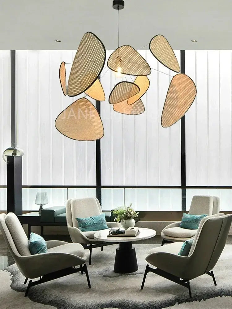 Modern pendant light featuring a beige-toned woven rattan chandelier with warm amber glow in the french design market