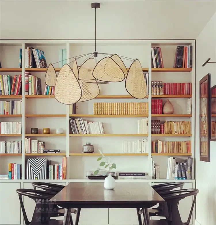 A modern beige rattan chandelier in a woven teardrop shape from DecorBites french design market for home lighting