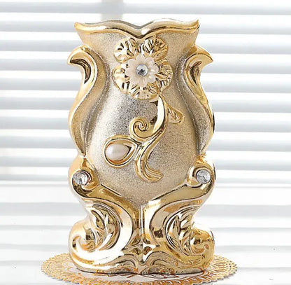 Gold-colored ornate frosted porcelain flower vase with floral scrollwork, pearl beads, and crystal accents for home decor