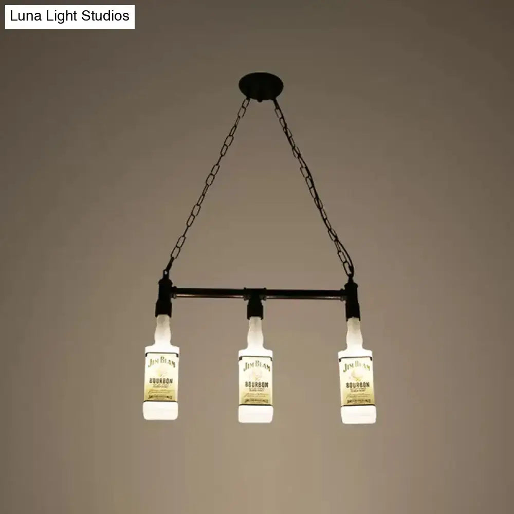 Black metal chandelier with three illuminated jim beam bourbon bottles suspended by chains in frosted white glass design