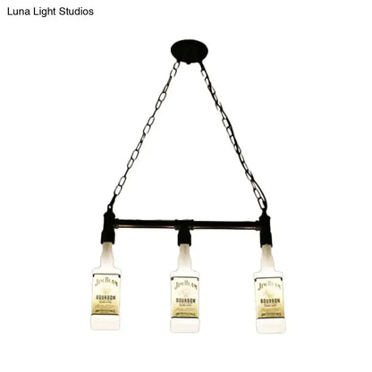 Black chain-and-bar pendant light with three illuminated jim beam bourbon bottles as lampshades in loft style
