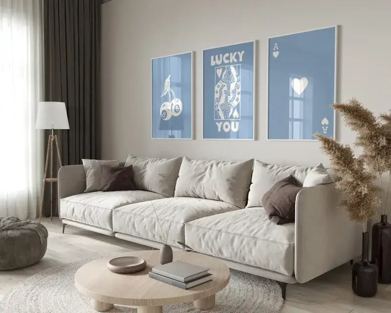 Beige upholstered sectional sofa with dark brown accent pillows next to DecorBites™ funky queen of hearts wall art set featuring ace card queen hearts wall art