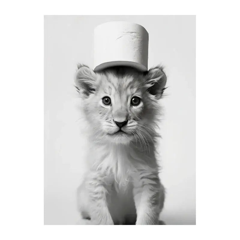 Black-and-white lion cub wearing a toilet paper roll top hat featured in DecorBites™ funny animals wall art for bathroom home