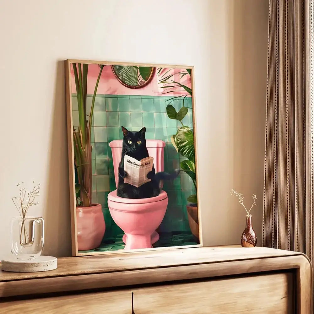 Decorbites™ funny cat bathroom wall art print featuring a black cat on pink toilet with green tiles and tropical plants